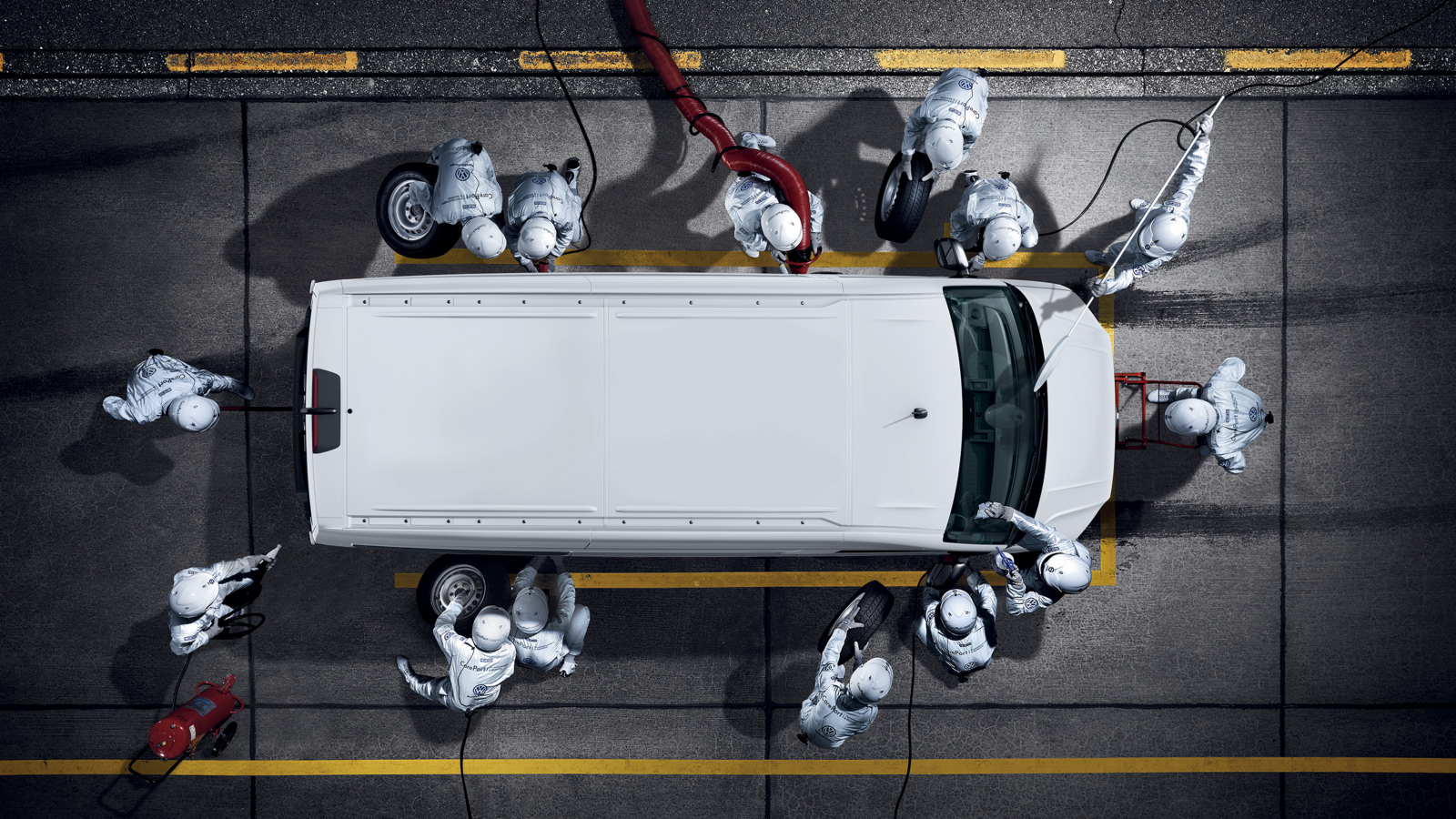Volkswagen service team working around a van